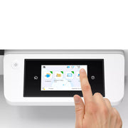 A close-up of a control panel with a black touchscreen display, showing a finger touching the screen. The screen displays folder and email icons.